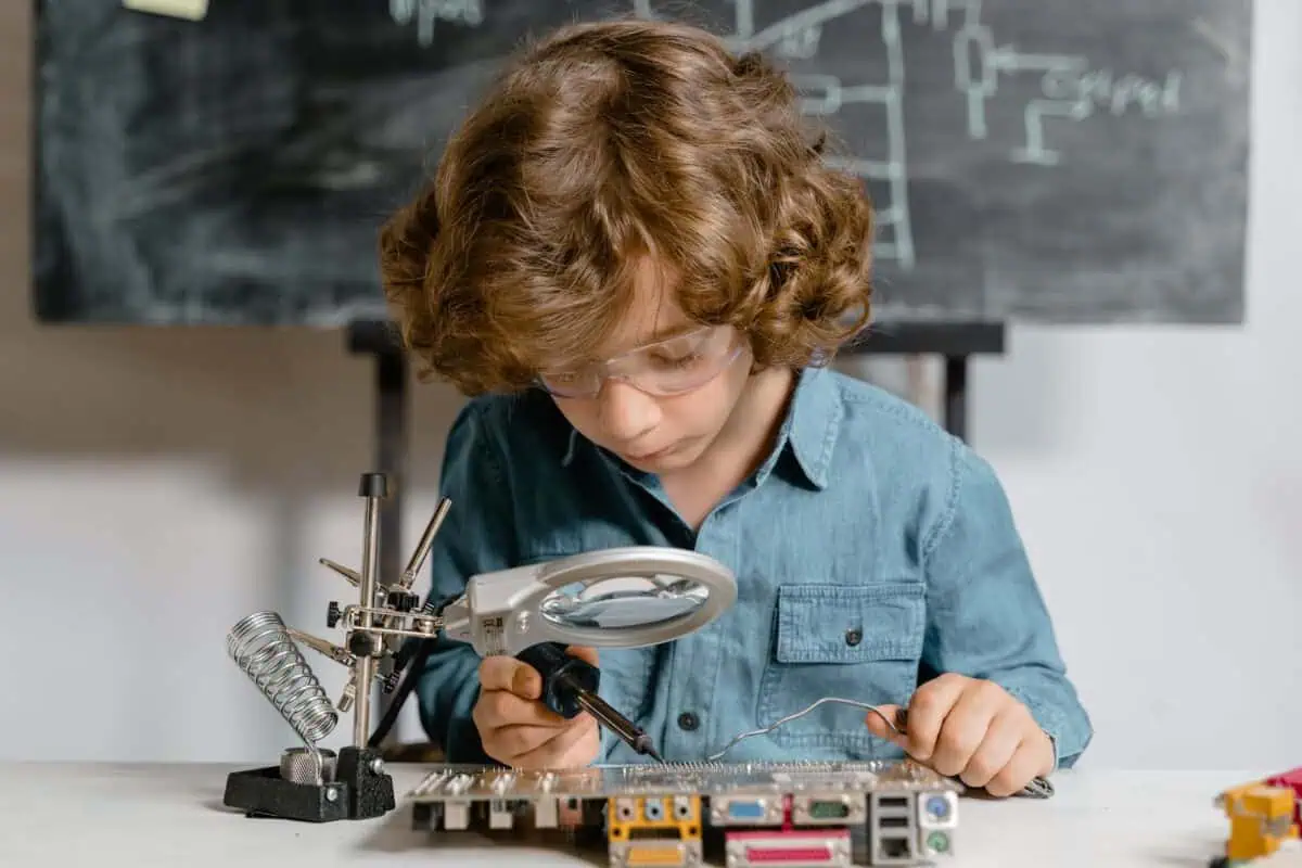 close up photo of a smart boy doing a science experiment