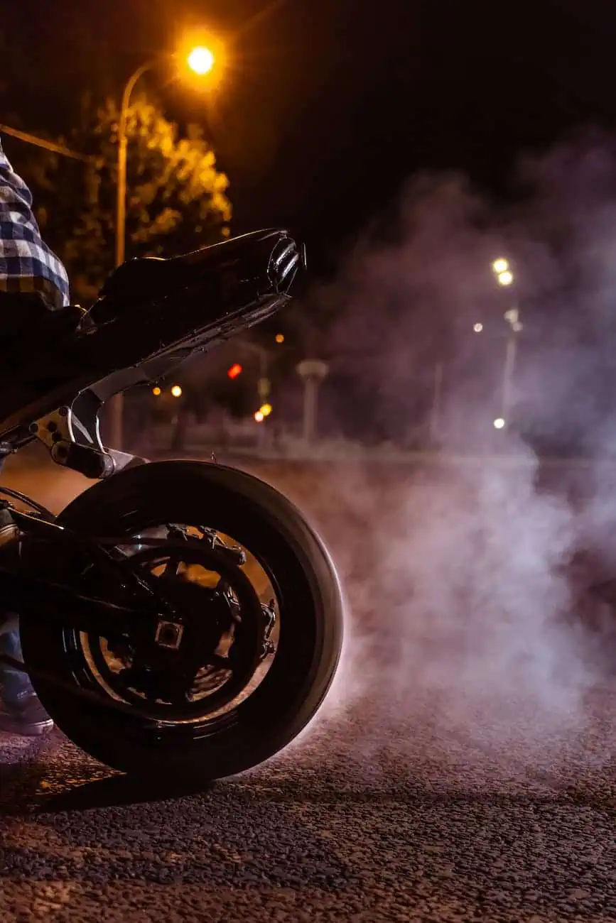 person doing burnout on motorbike