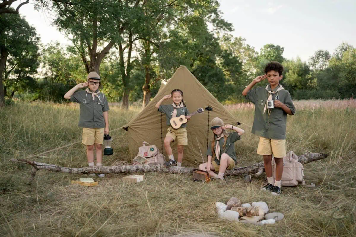 group of kids saluting