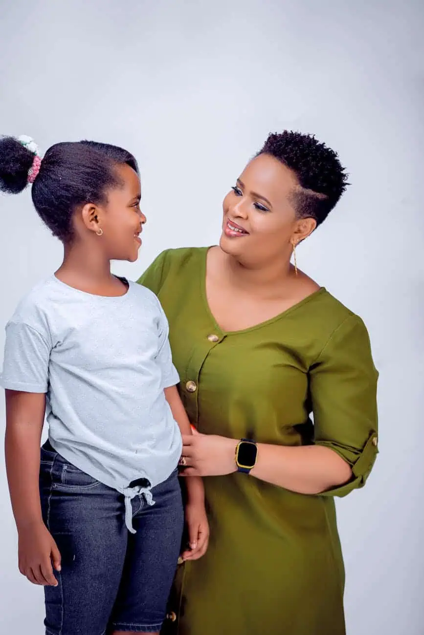 mother and daughter smiling together indoors
