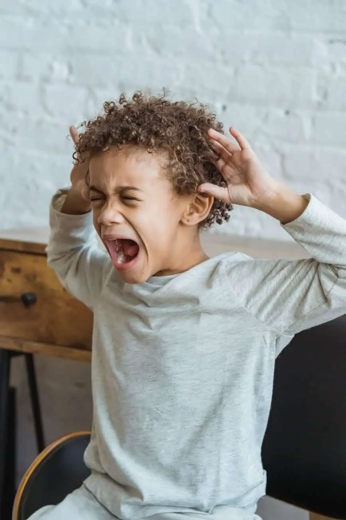 desperate screaming young boy