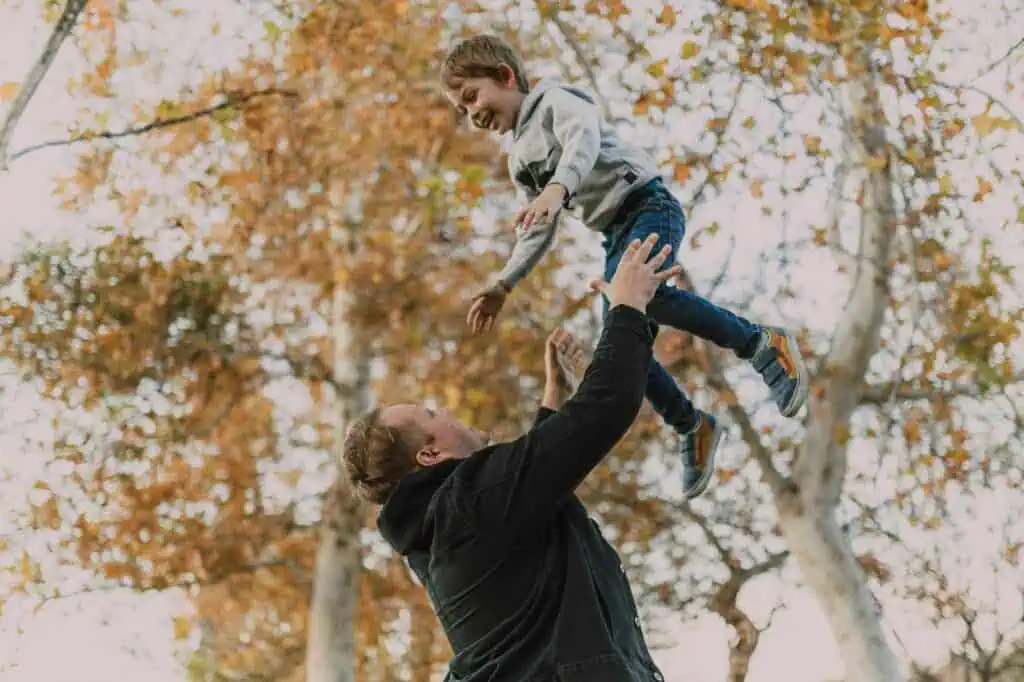 photo of father and son having fun