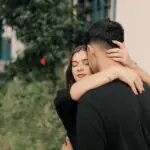 romantic embrace outdoors in soft light