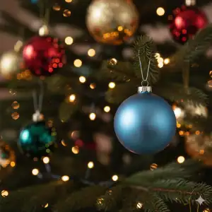 A single, muted-blue ornament on a festive tree, symbolizing holiday depression—a condition treated by our psychologists in Sarasota and Venice, FL.