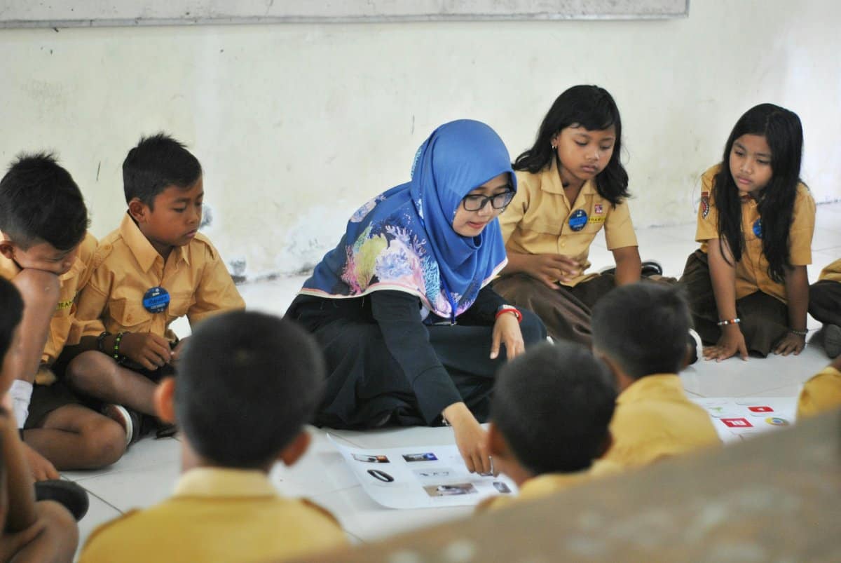 A diverse classroom setting showing children engaging in various activities for educational assessment