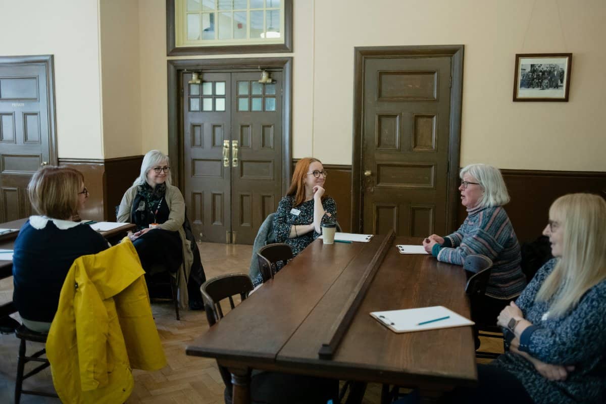 A group of adults meeting to discuss a child's educational plan
