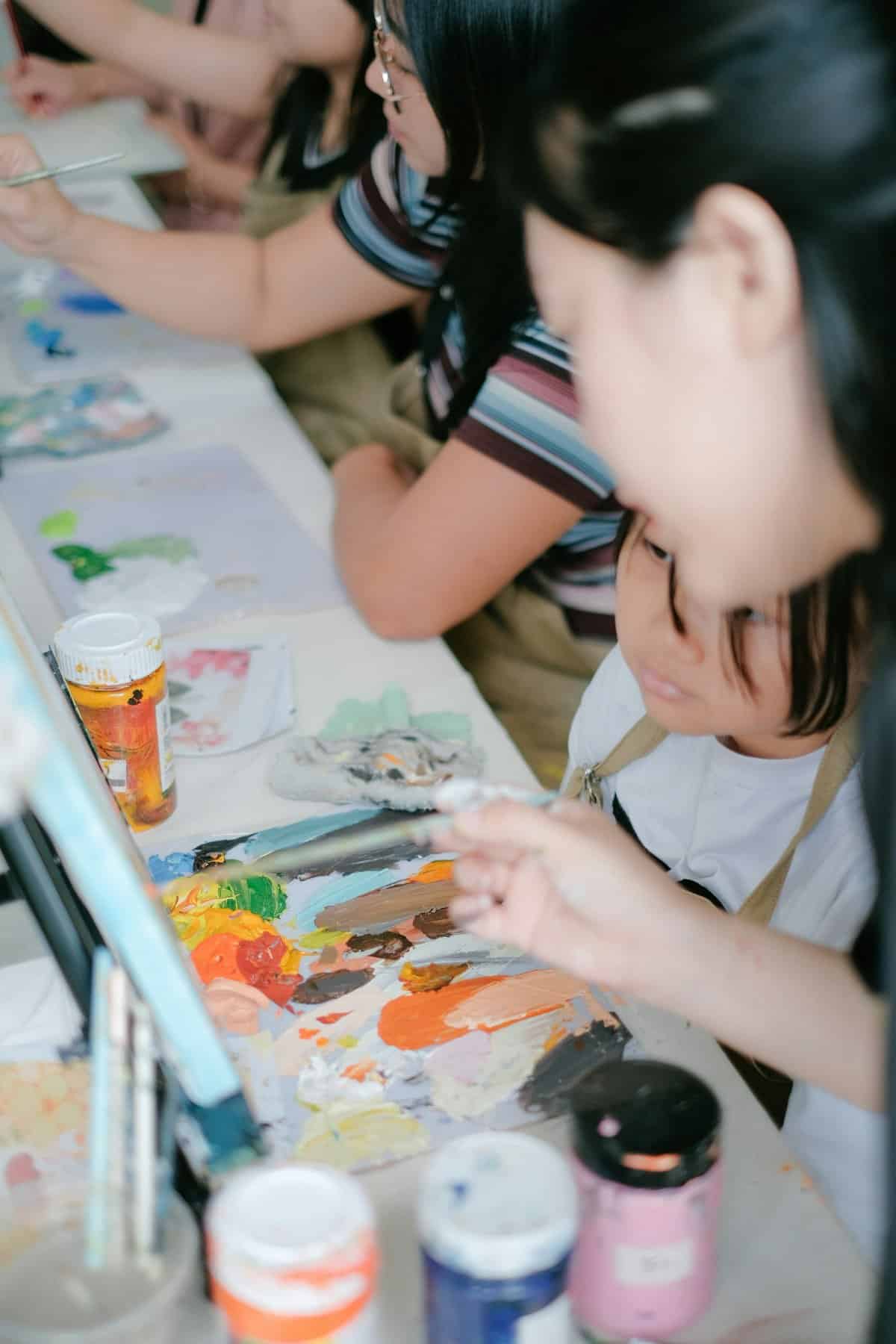 A child passionately engaging in a creative activity like painting or building