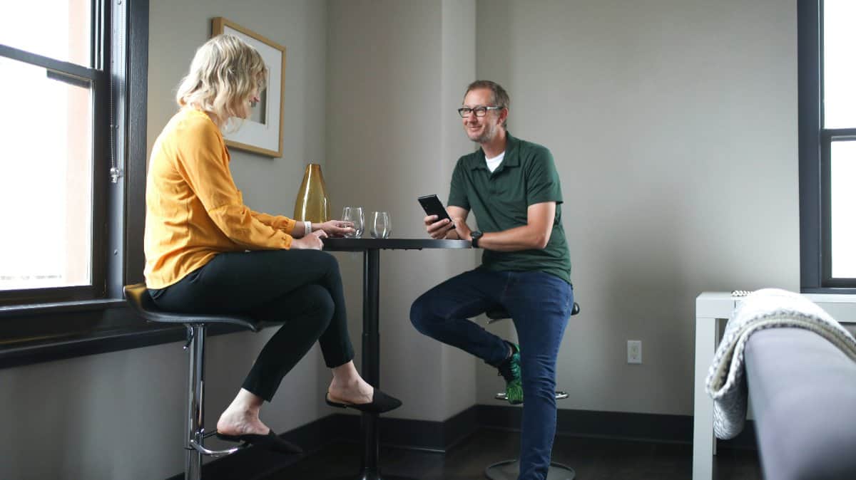 A couple having a heartfelt conversation at home
