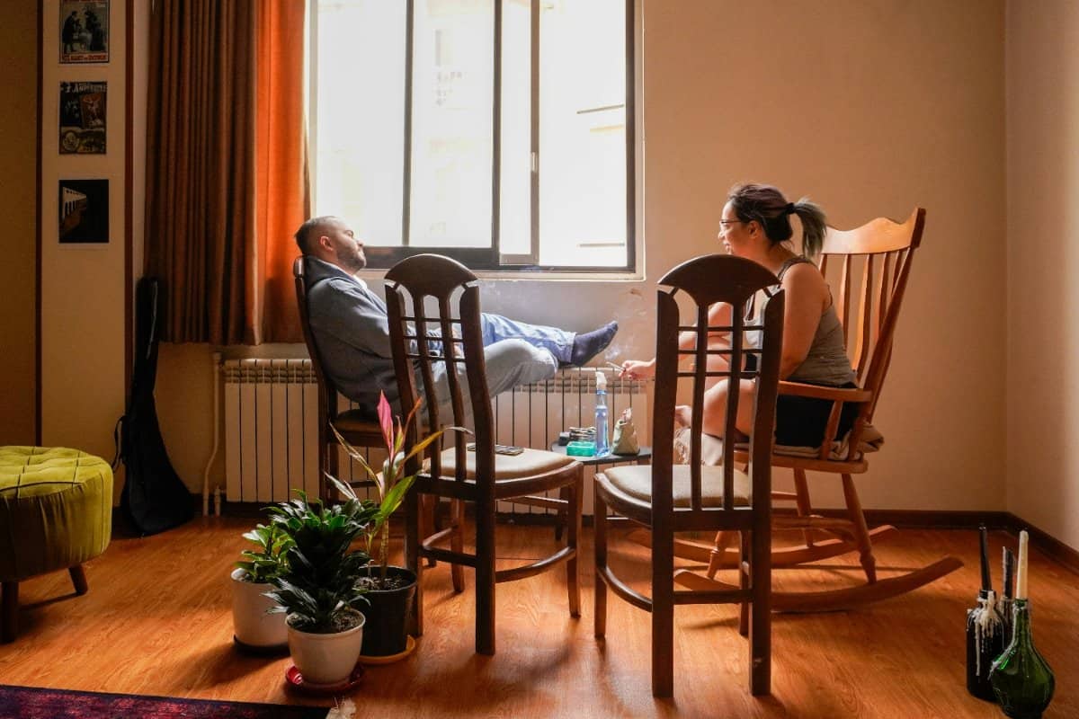 A couple having a lighthearted moment together in their living room