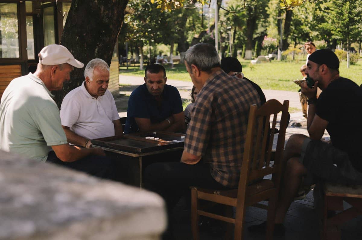A diverse group of men having an open conversation about mental health