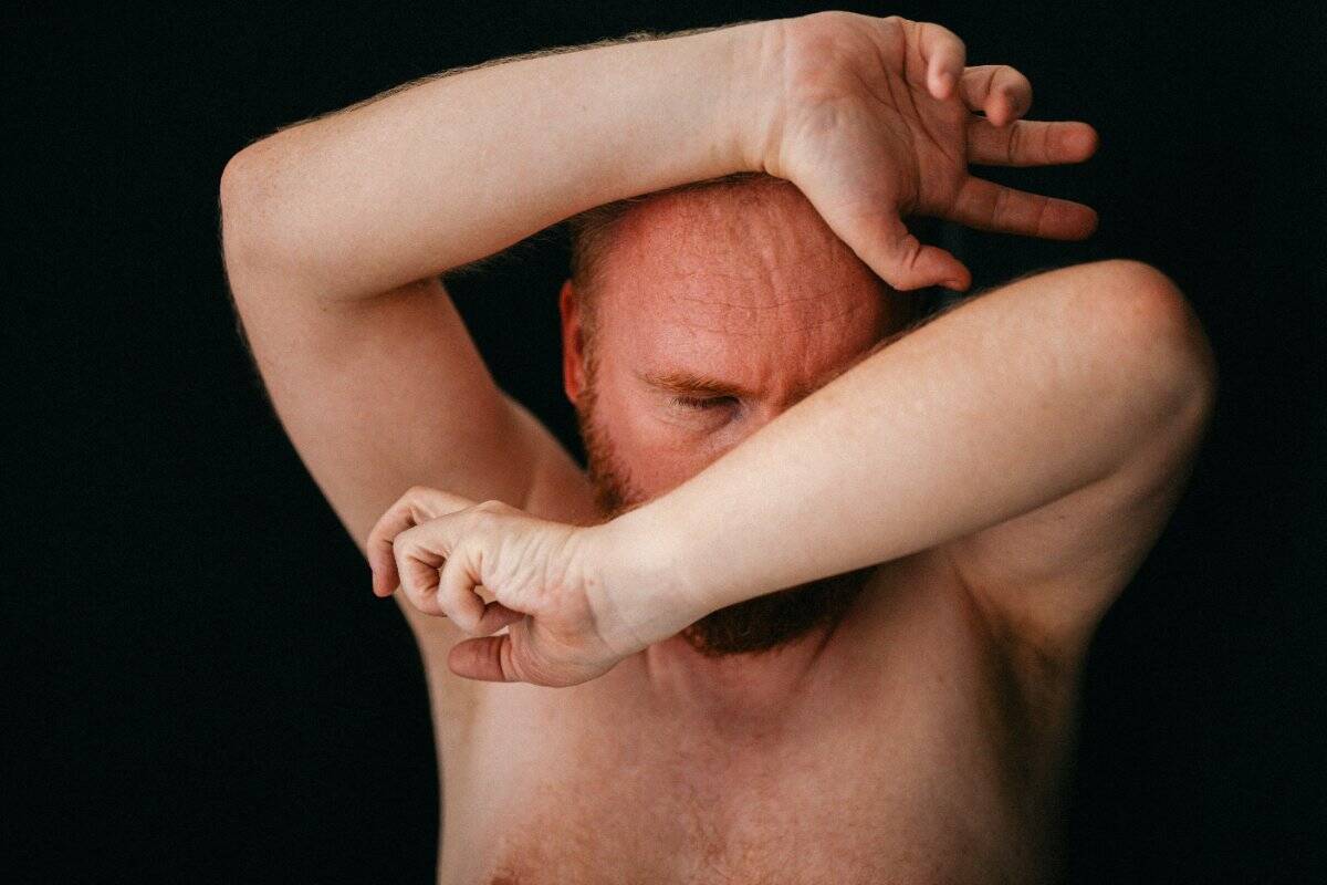 A man holding his head in distress