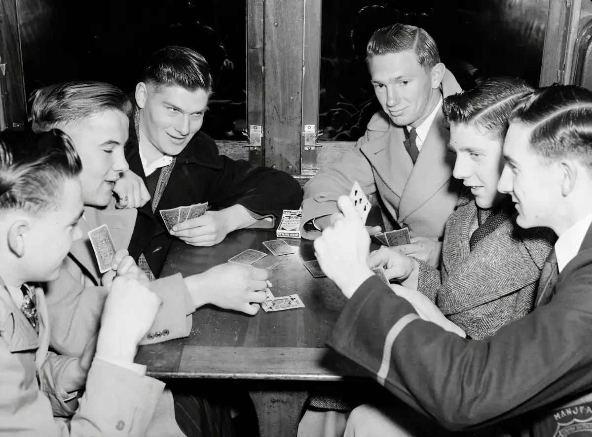 A group of men talking openly around a table, engaging in a supportive discussion