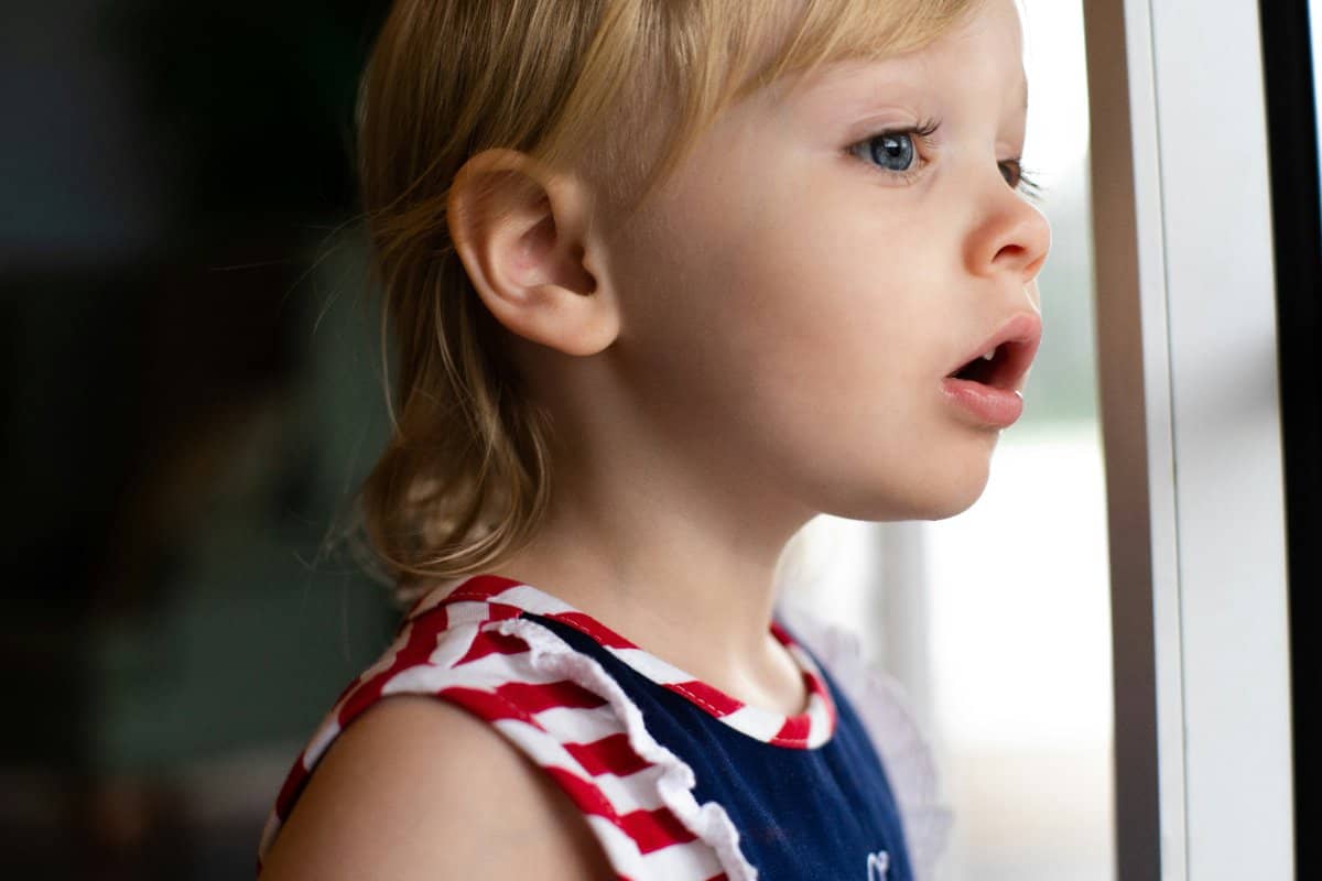 Parent praising a child for good behavior with a high-five