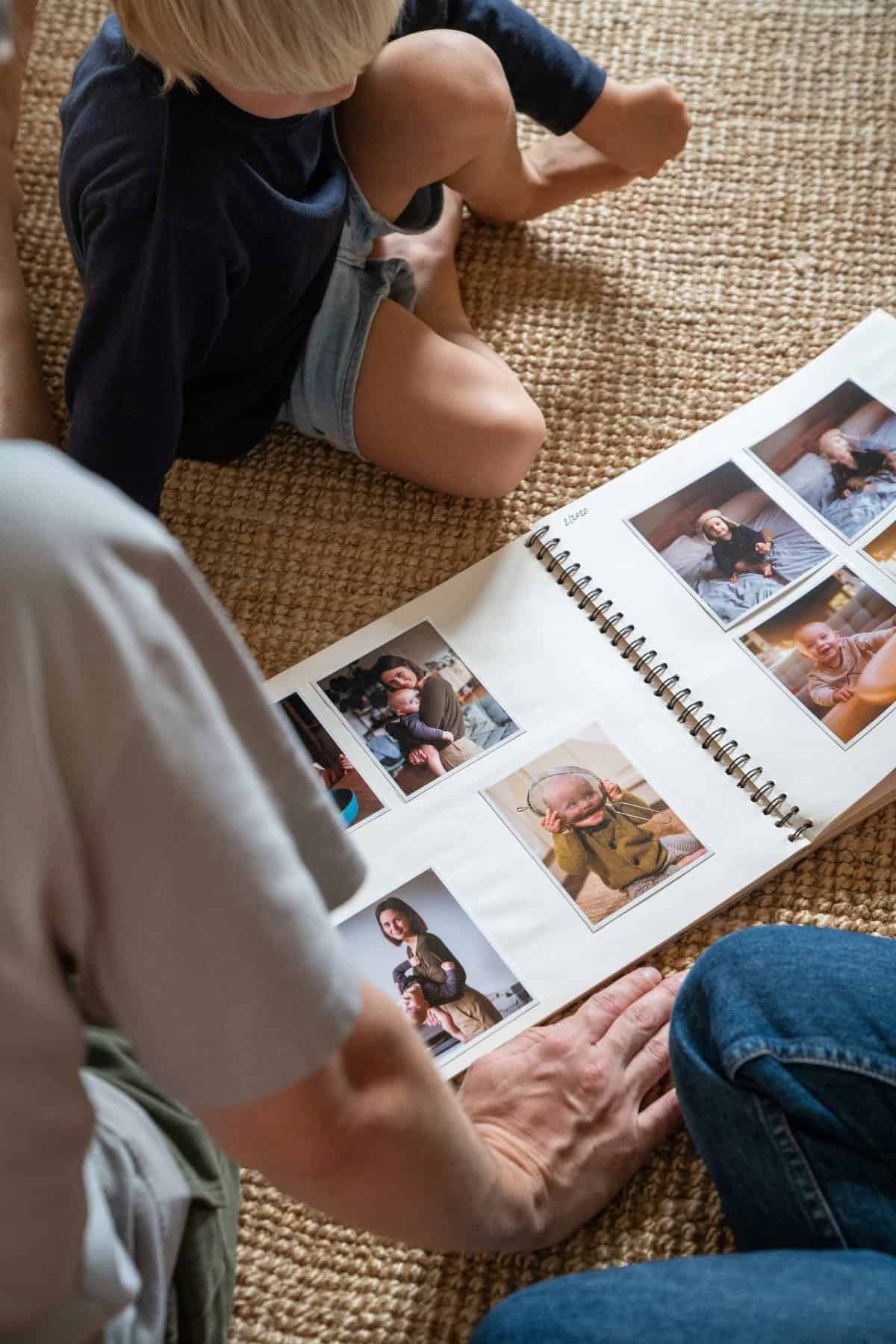 Family creating a scrapbook with vacation photos.