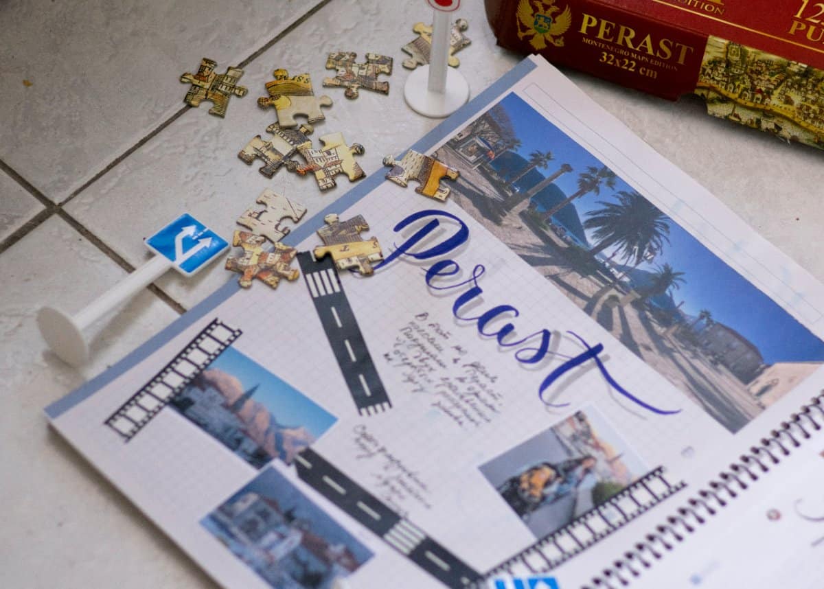 A family planning their trip with a visual schedule and travel brochures.