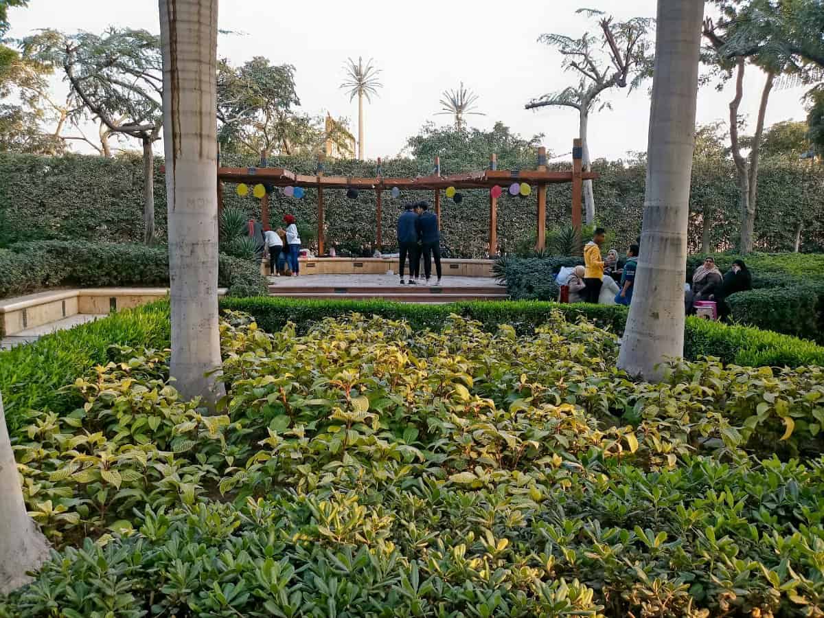 A family enjoying an autism-friendly attraction, such as a quiet park or sensory-friendly museum.