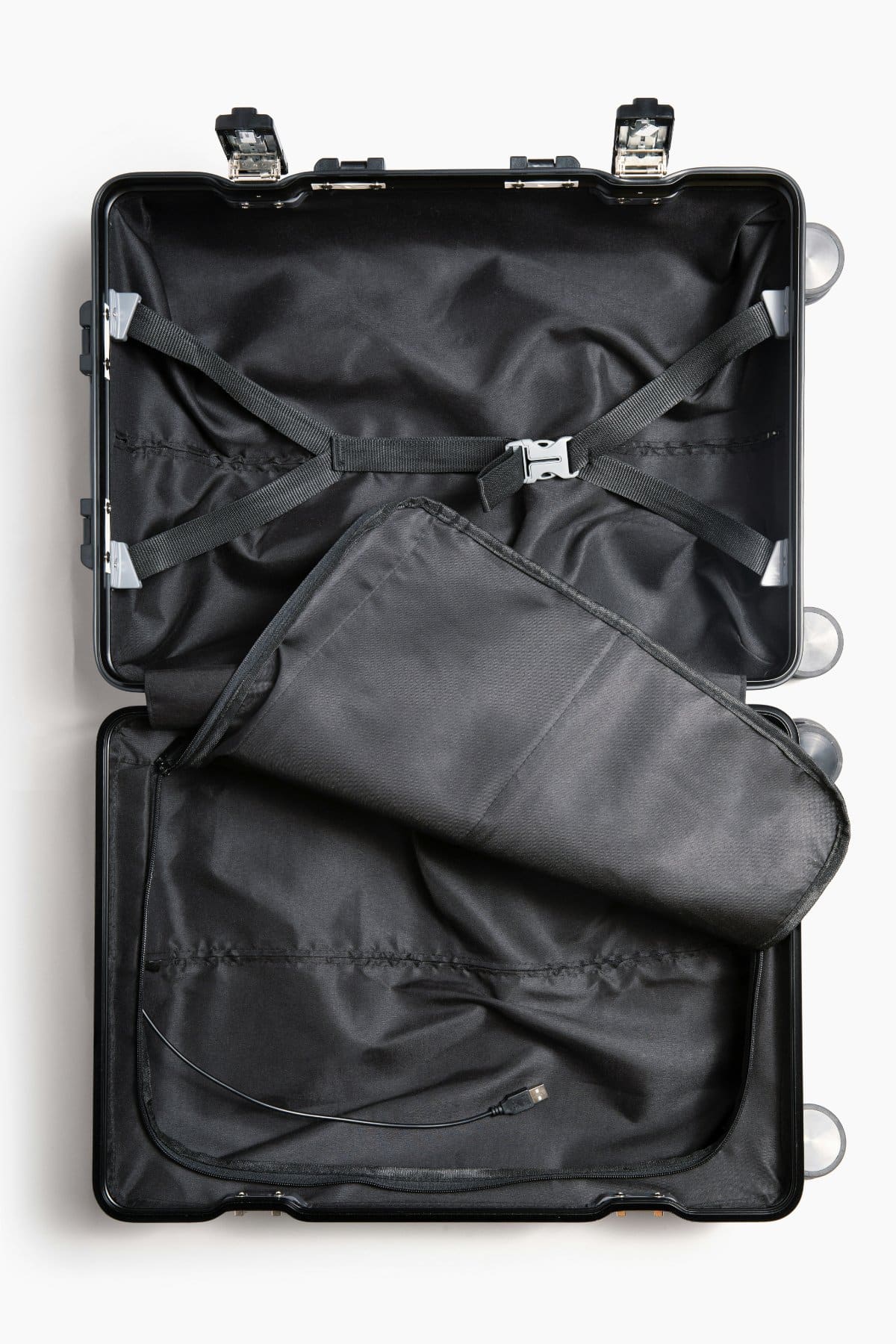 A suitcase with comfort items and sensory tools, ready for a family vacation.