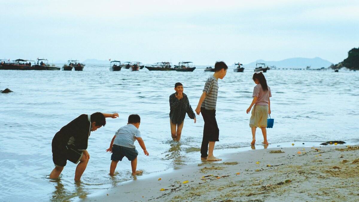 A family enjoying a bonding moment on vacation, engaged in a shared activity.