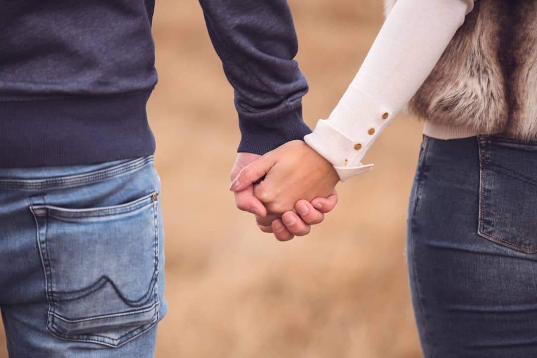Couple holding hands