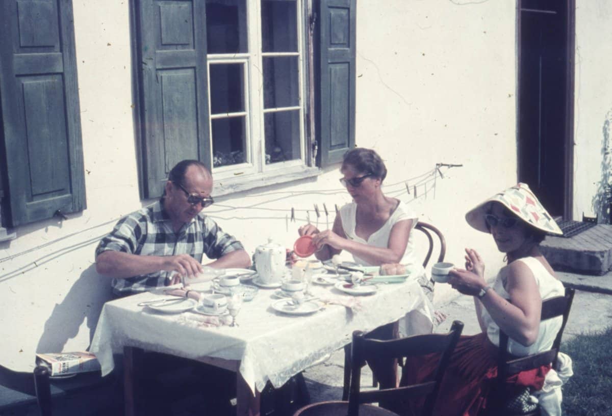 Family gathered around a table having a discussion