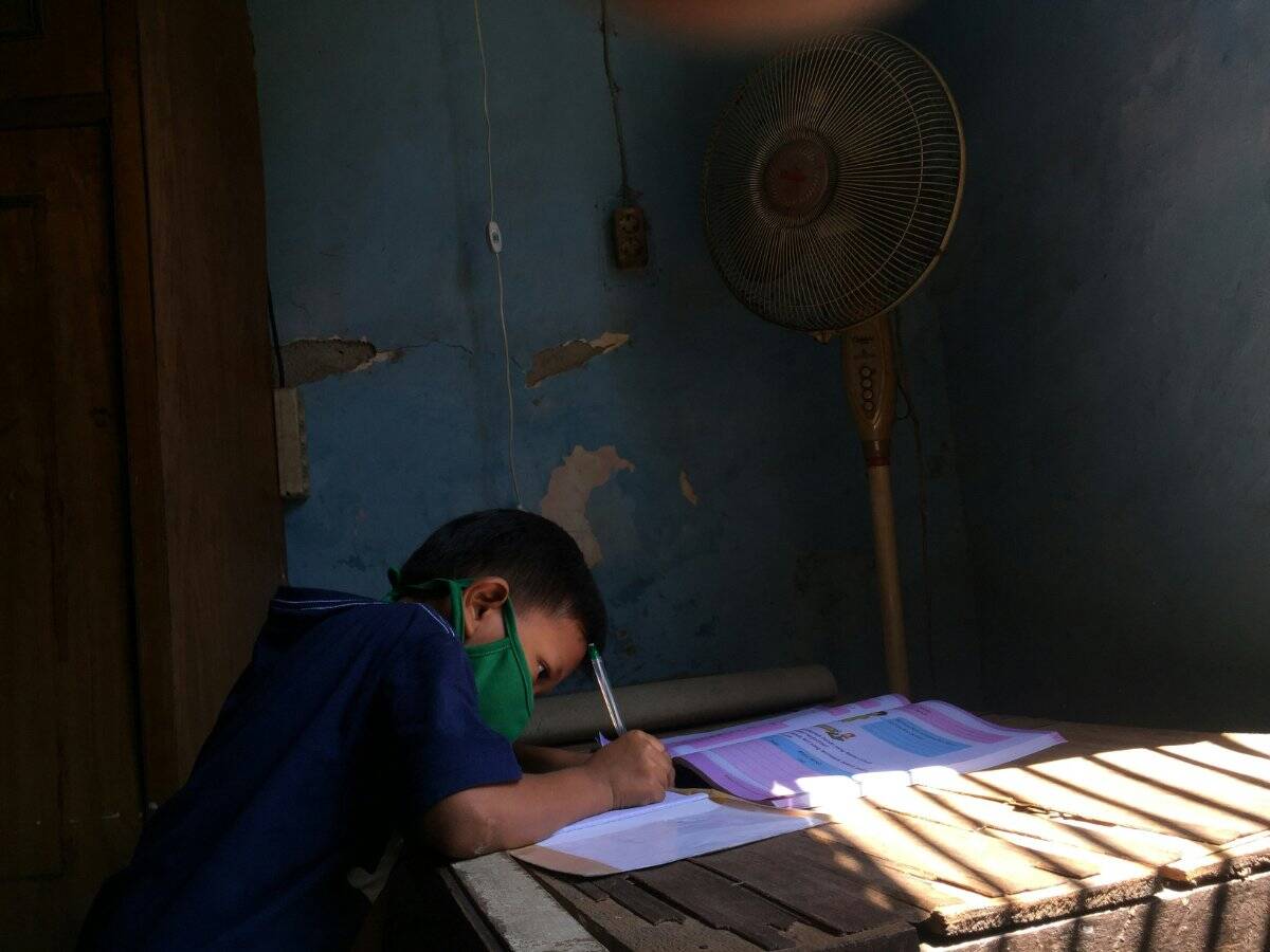 Educator and gifted student working on an advanced project